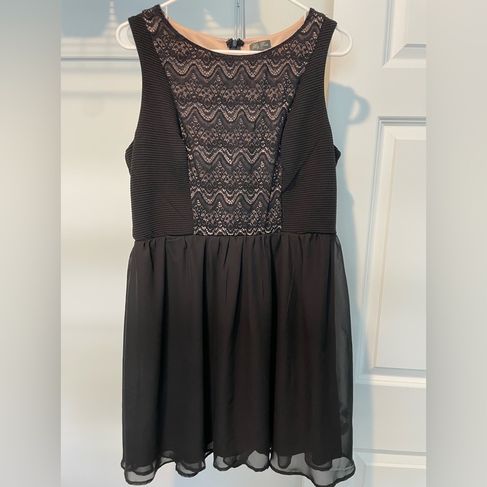Black nylon dress with light pink lace detail. Size 13.